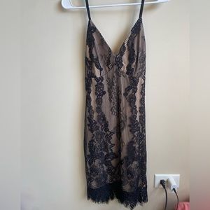 Black lace tight Windsor dress, nude under the lace